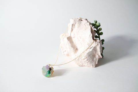 Amulet necklace in coral reef