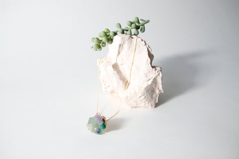Amulet necklace in coral reef
