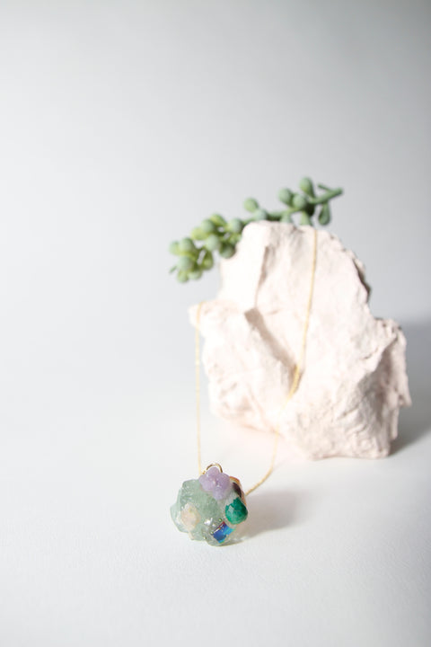 Amulet necklace in coral reef