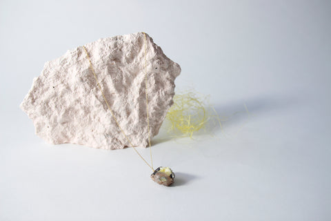 Amulet necklace in earthly wonder