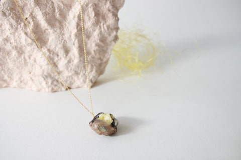 Amulet necklace in earthly wonder
