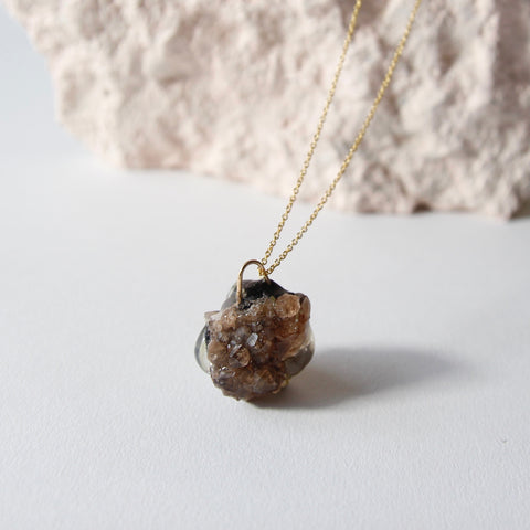 Amulet necklace in earthly wonder