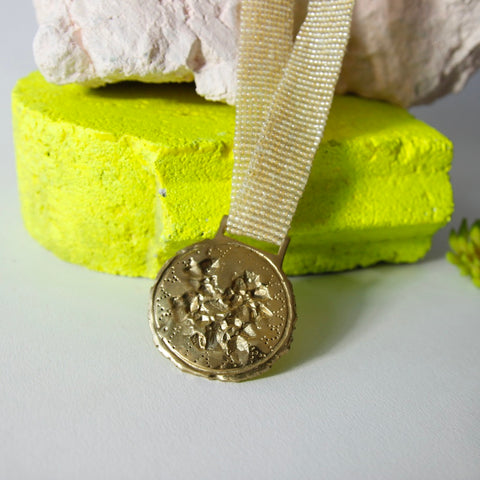 Medium brass medal