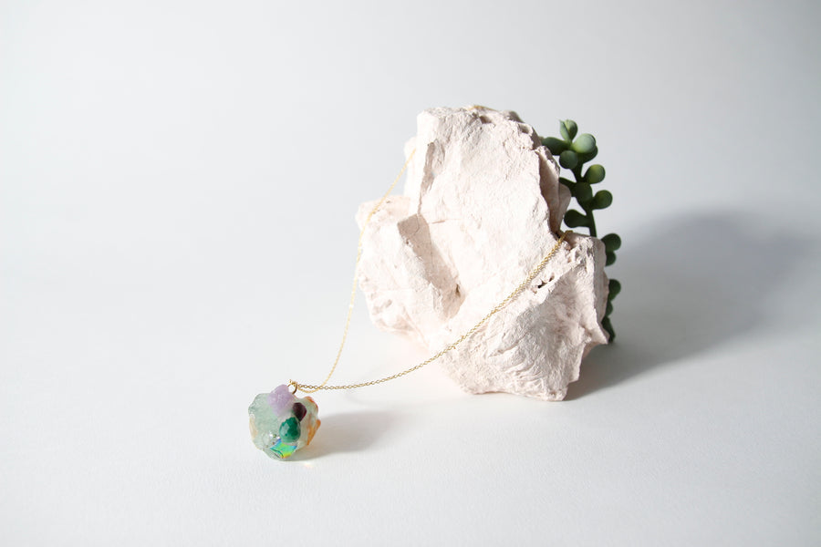 Amulet necklace in coral reef
