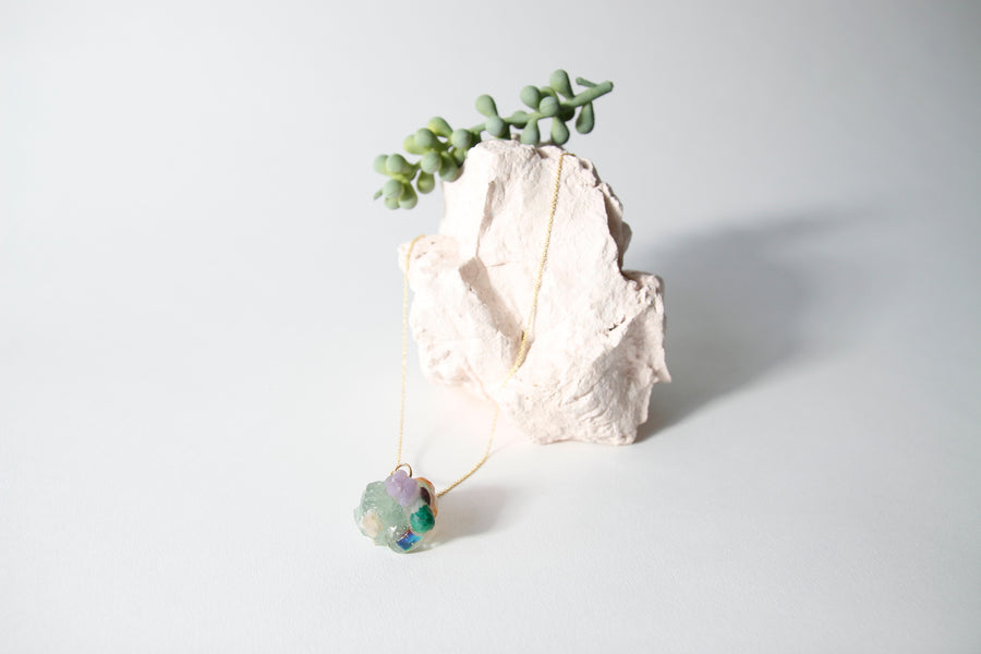 Amulet necklace in coral reef