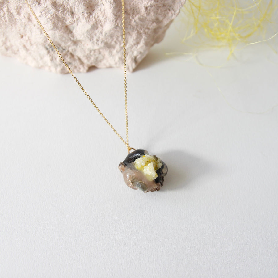 Amulet necklace in earthly wonder